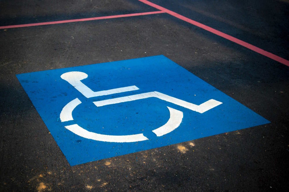 Handicap parking space, Photo by AbsolutVision on Unsplash